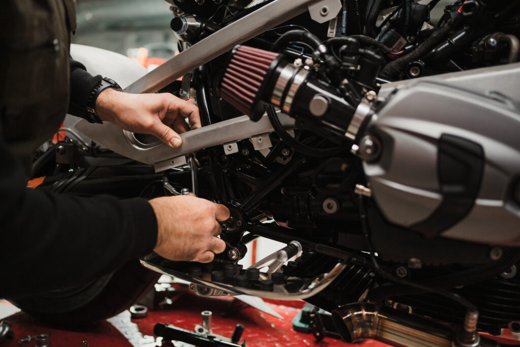 Man fixing a motorcycle